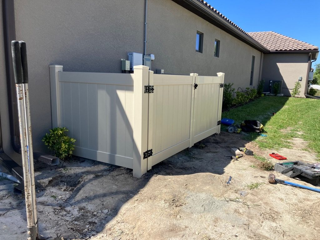 North River Fence Completes Specialized Residential Installation of 21 Feet of 4-Foot High Tan PVC Privacy Fence for Pool Equipment in Esplanade at Artisan Lakes Community